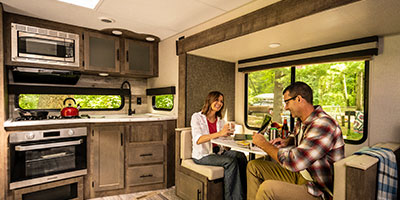 2020 KZ RV Connect C261RKK Travel Trailer with Couple at Dinette