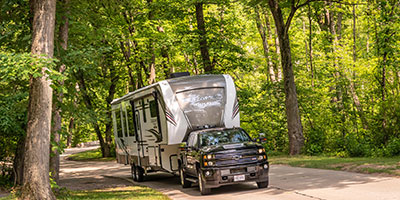 2020 KZ RV Durango Gold G391RKQ Fifth Wheel Exterior being towed down road