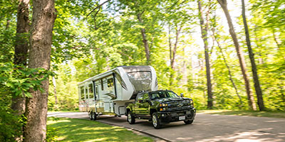 2020 KZ RV Durango Gold G391RKQ Fifth Wheel Exterior being towed down road