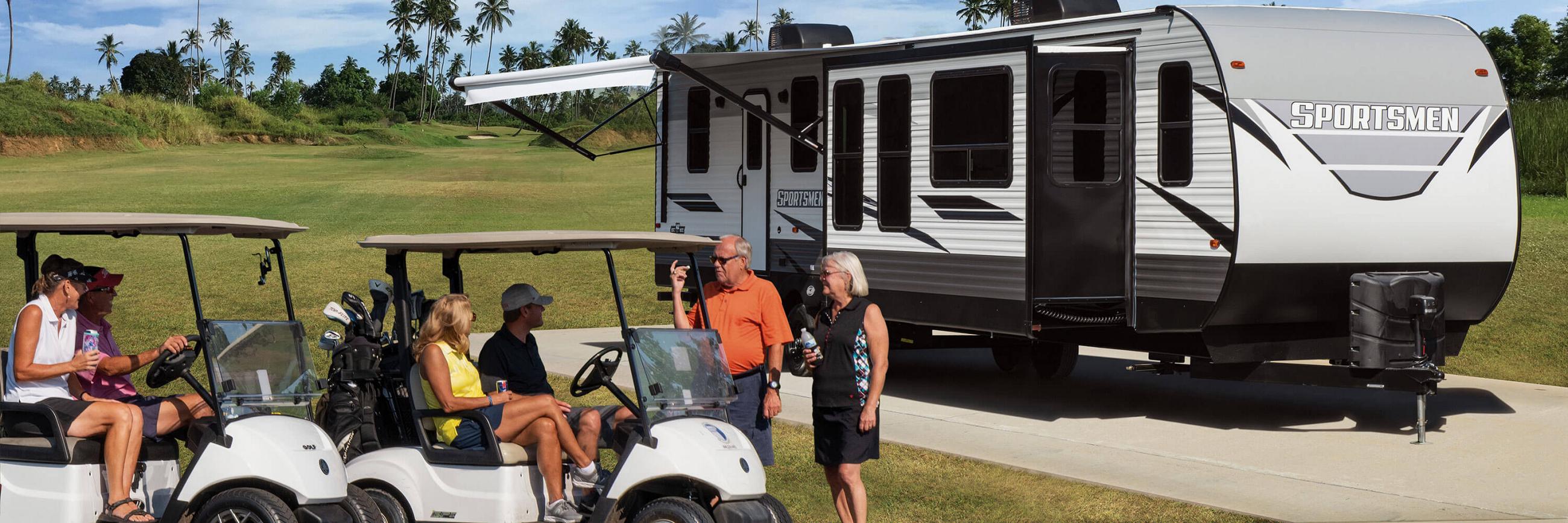 2023 KZ RV Sportsmen 364BH Destination Travel Trailer with Golfers at Golf Course